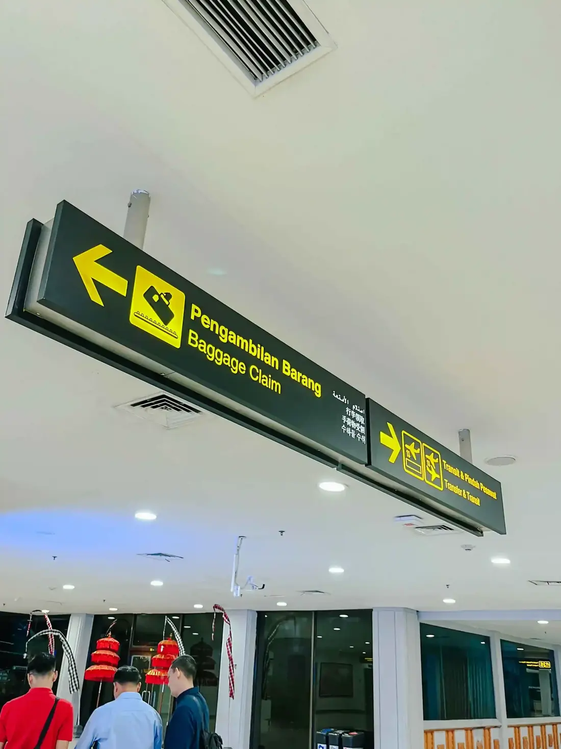 Baggage claim sign at Bali Ngurah Rai arrivals hall