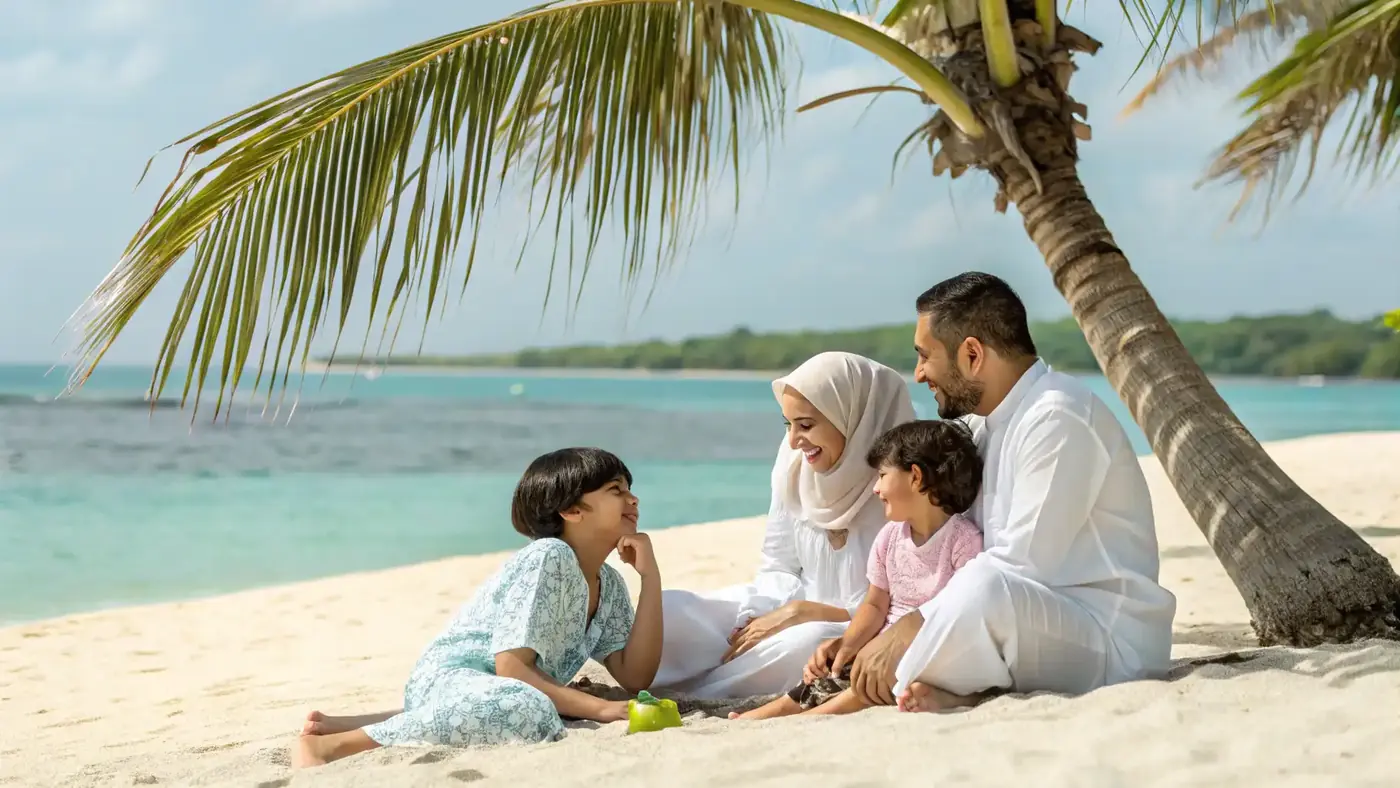 Family relaxing on a white-sand beach under palms